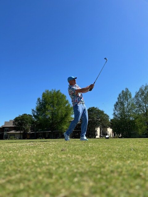 A veteran's follow-through on the tee