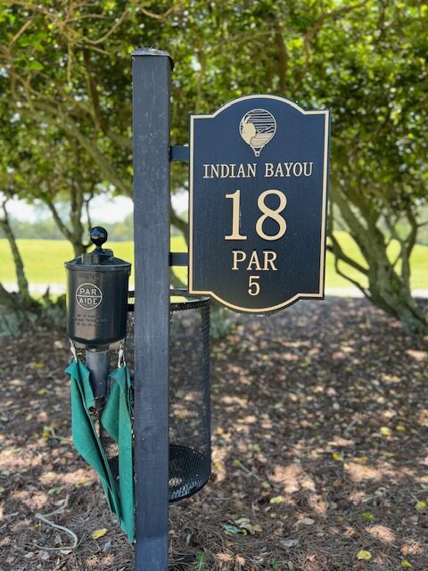The hole marker for Indian Bayou, hole 18, a par 5